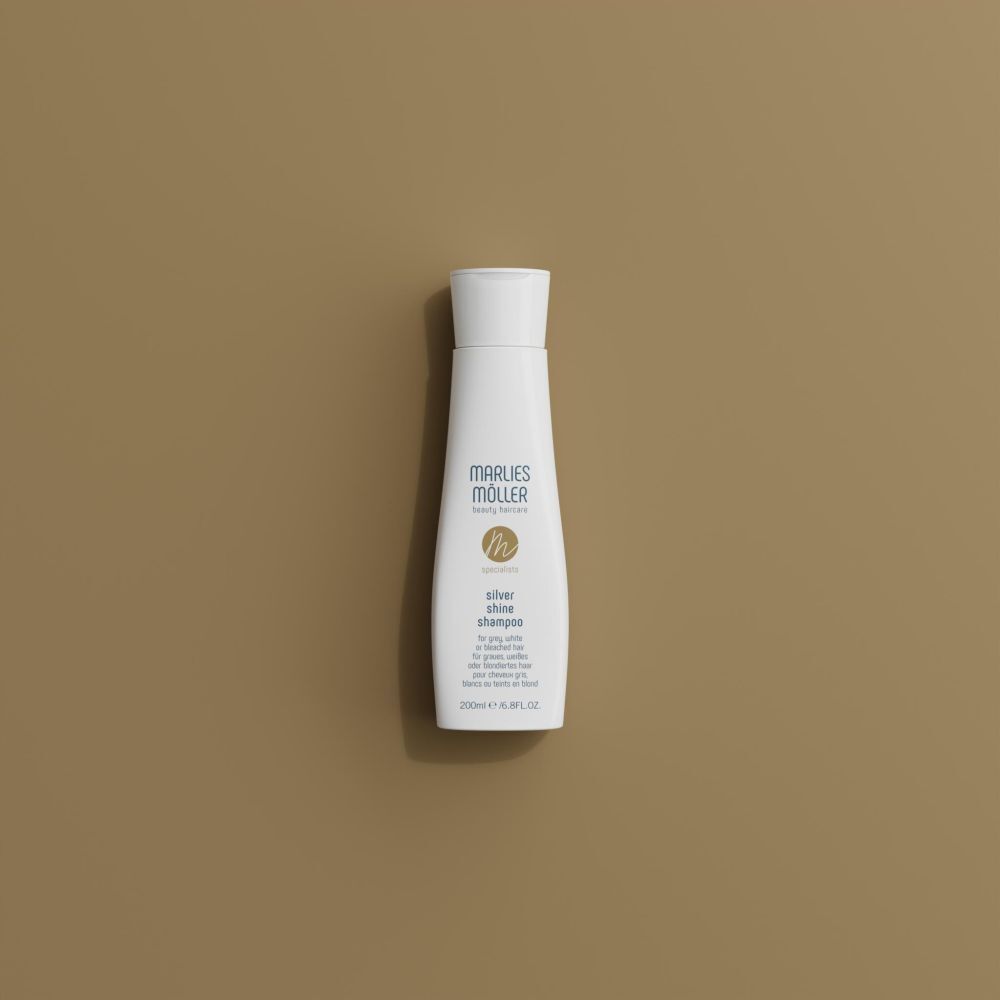 Marlies Möller Silver Shine Shampoo. Weißes Shampoo auf braunem Hintergrund. Aufschrift: Silver Shine Shampoo. 200ml.