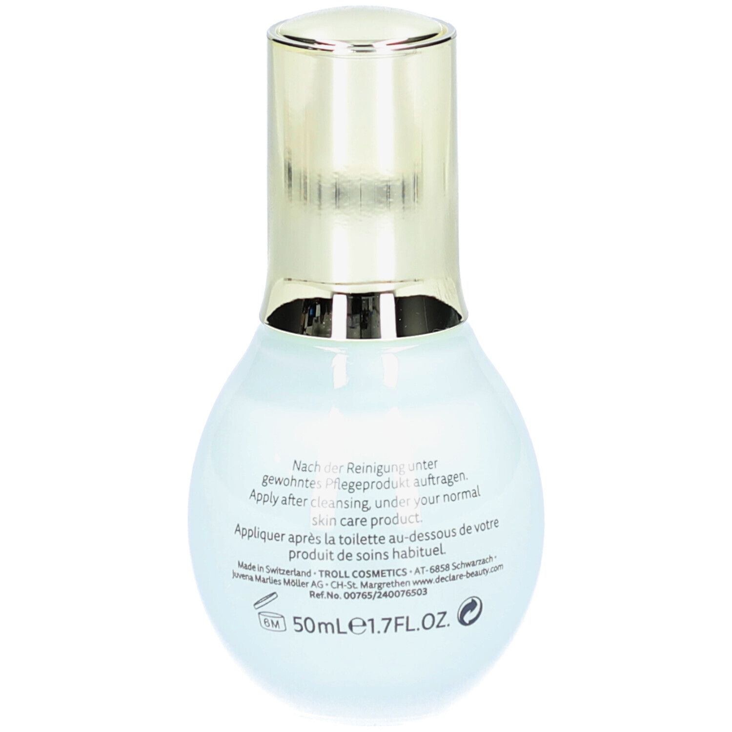 Hellblaue Flasche mit goldfarbenem Deckel. Auf der Rückseite Text in mehreren Sprachen, 50ml.