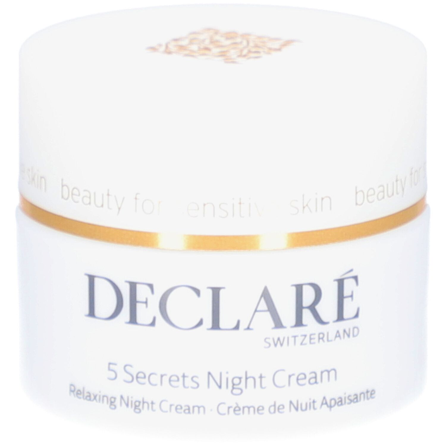 Weißer Tiegel mit goldfarbenem Deckel. Aufschrift: DECLARÉ, 5 Secrets Night Cream. Text: Relaxing Night Cream, Crème de Nuit Apaisante.