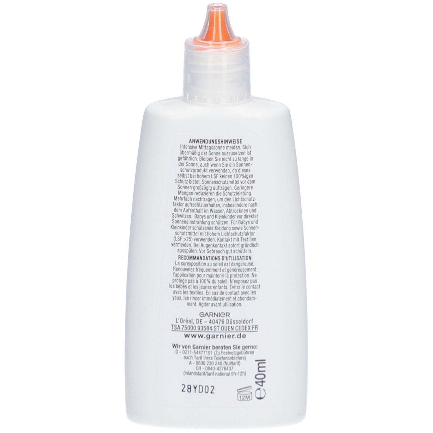 Rückseite einer weißen Garnier Ambre Solaire Flasche. Text: Anwendungshinweise, Inhaltsstoffe, Herstellerinformationen.
