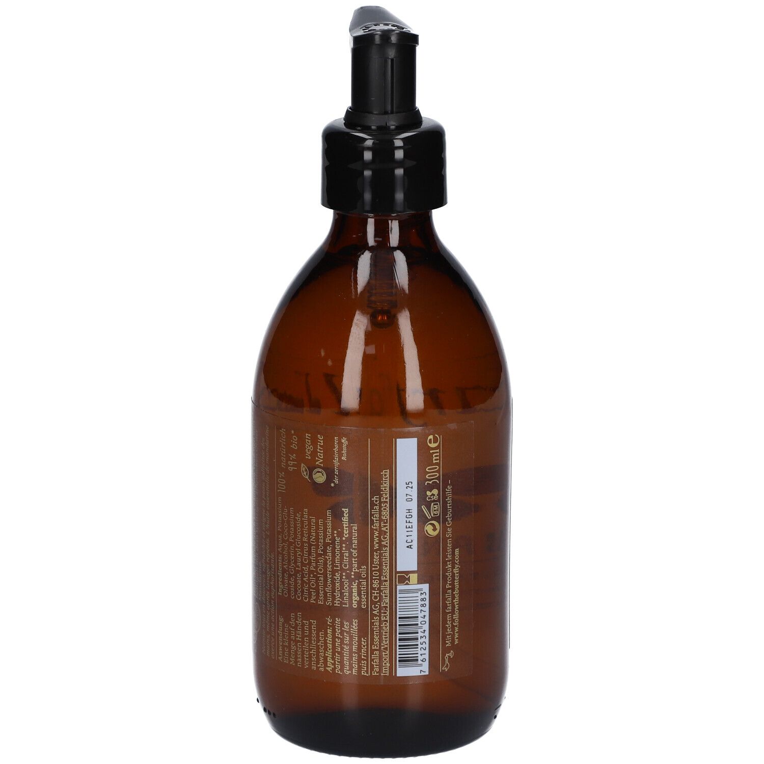 Braune Glasflasche mit schwarzem Pumpkopf. Rückseite mit Text. Etikett mit Informationen.