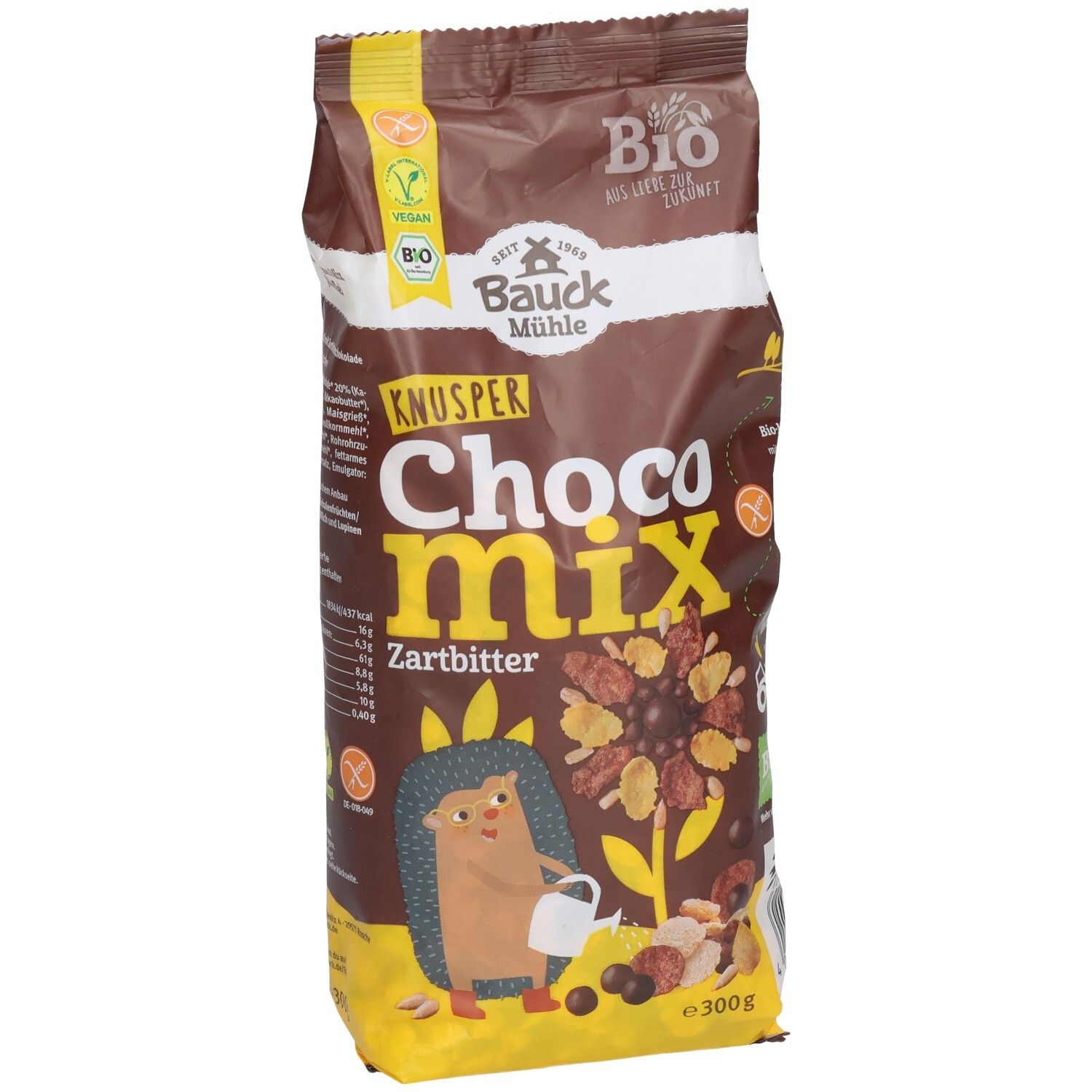 Braune Tüte mit Aufschrift "KNUSPER Choco Mix Zartbitter". Vegan- und Bio-Siegel. Abbildung eines Igels und Cerealien.