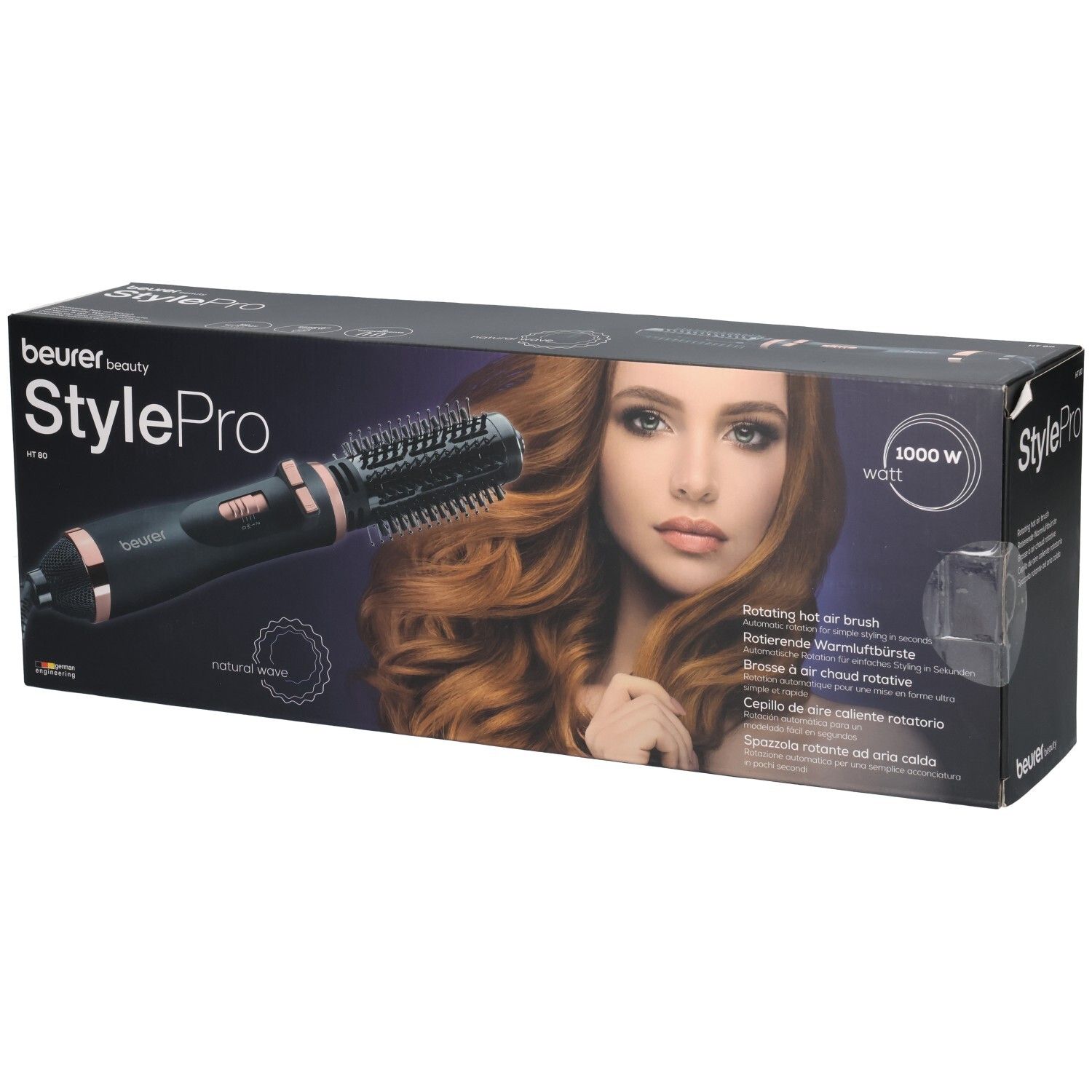 Beurer StylePro Warmluftbürste in Verpackung. Schwarze Bürste mit roségoldfarbenen Akzenten. Produktname und Modellbezeichnung.