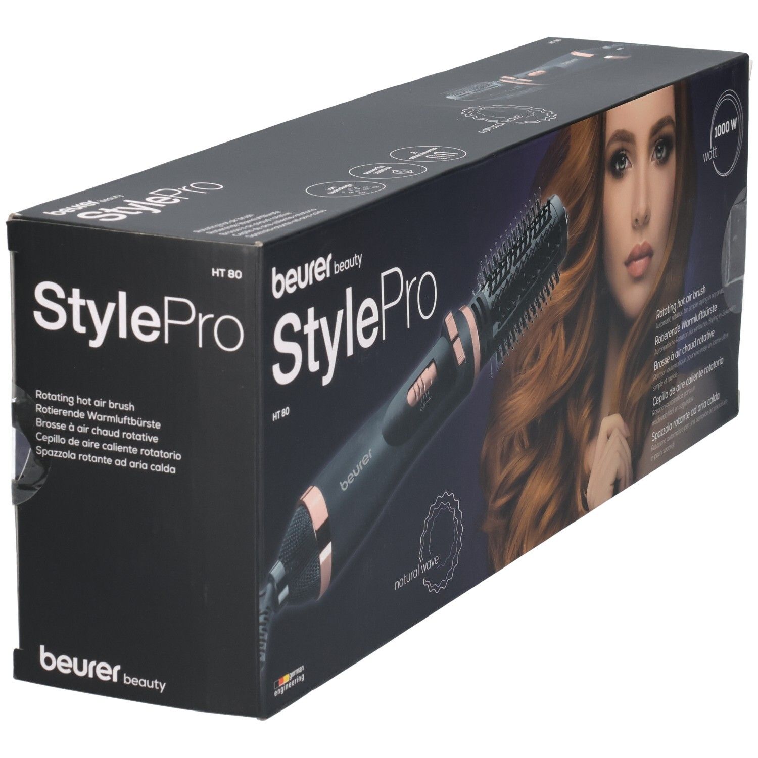Beurer StylePro Warmluftbürste in Verpackung. Schwarze Bürste mit roségoldfarbenen Akzenten. Produktname und Modellbezeichnung.