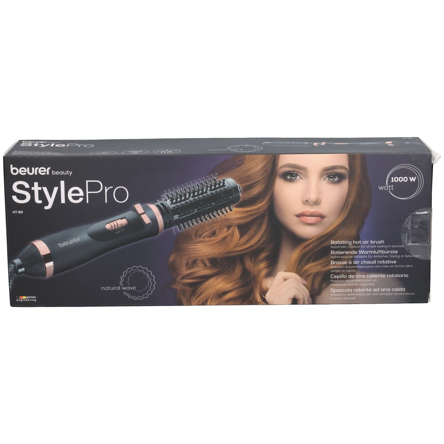 Beurer StylePro Warmluftbürste in Verpackung. Schwarze Bürste mit roségoldfarbenen Akzenten. Produktname und Modellbezeichnung.
