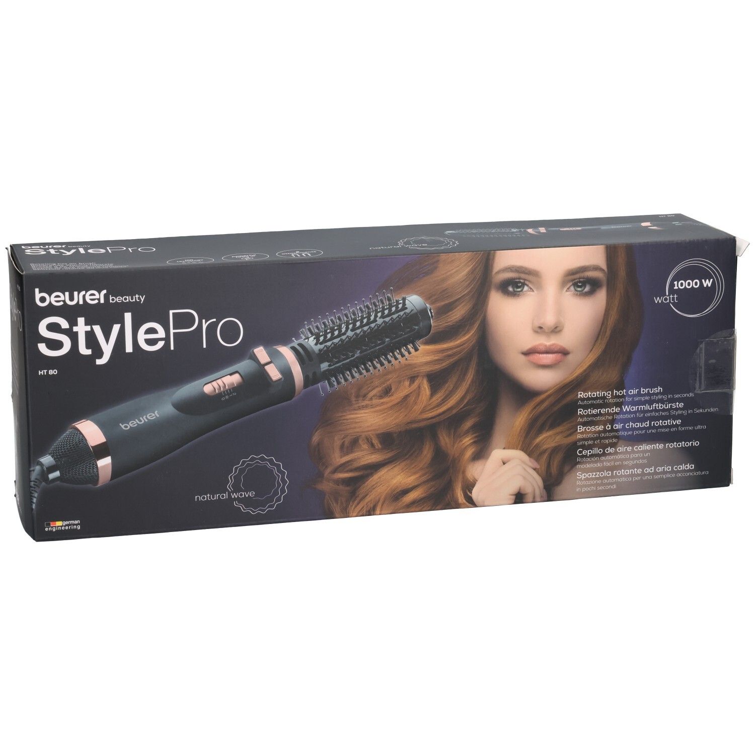 Beurer StylePro Warmluftbürste in Verpackung. Schwarze Bürste mit roségoldfarbenen Akzenten. Produktname und Modellbezeichnung.