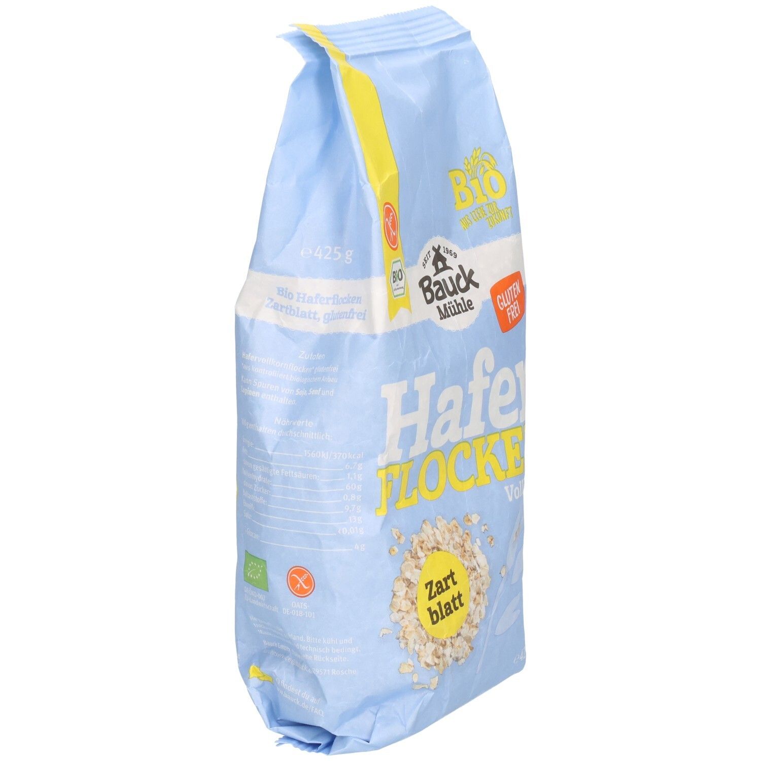 Hellblaue Tüte mit Haferflocken. Aufdruck: Bauck Mühle, Haferflocken Zartblatt glutenfrei. Bio-Siegel und Glutenfrei-Logo.
