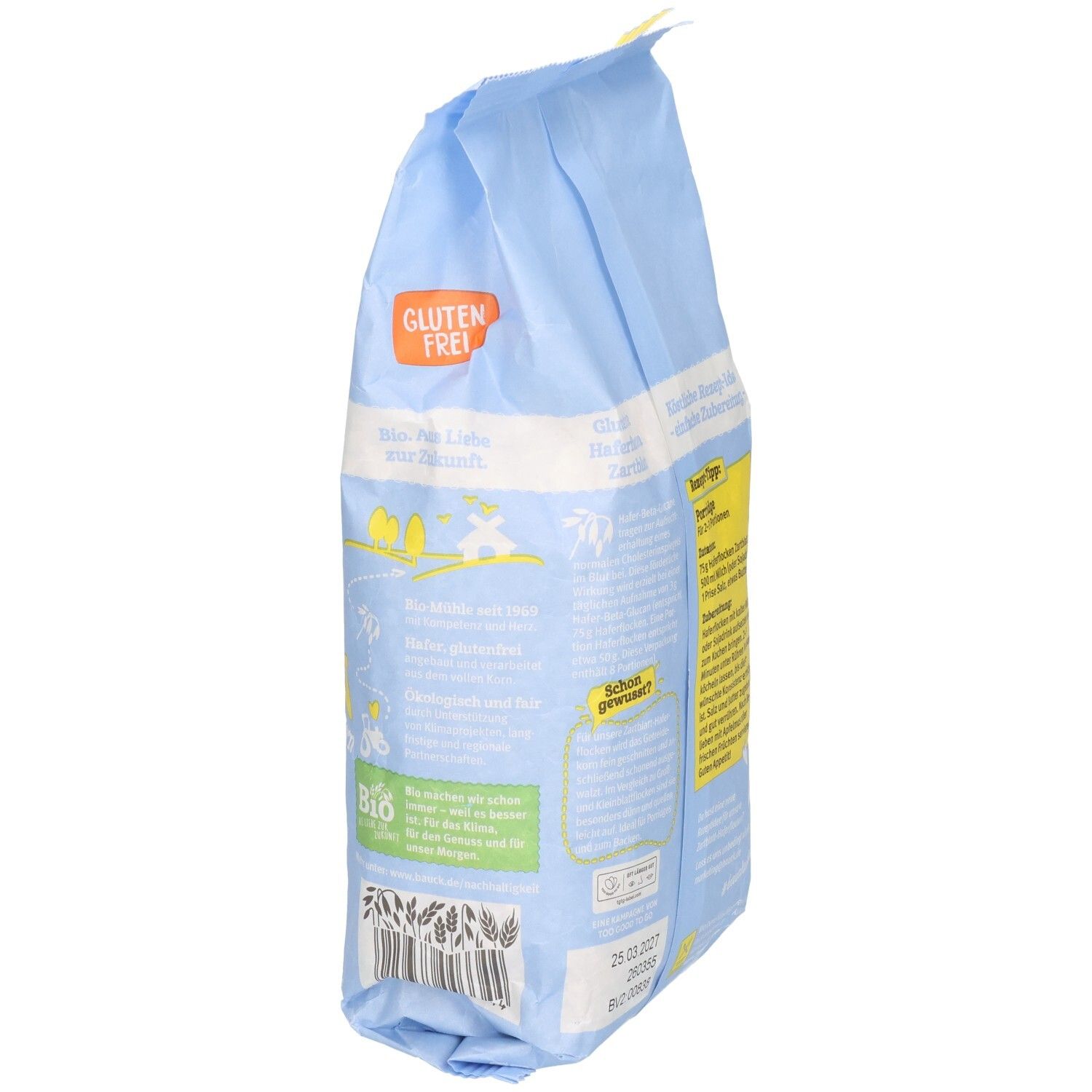 Hellblaue Tüte mit Haferflocken. Aufdruck: Glutenfrei, Bio-Siegel. Text in deutscher Sprache. Seitenansicht.