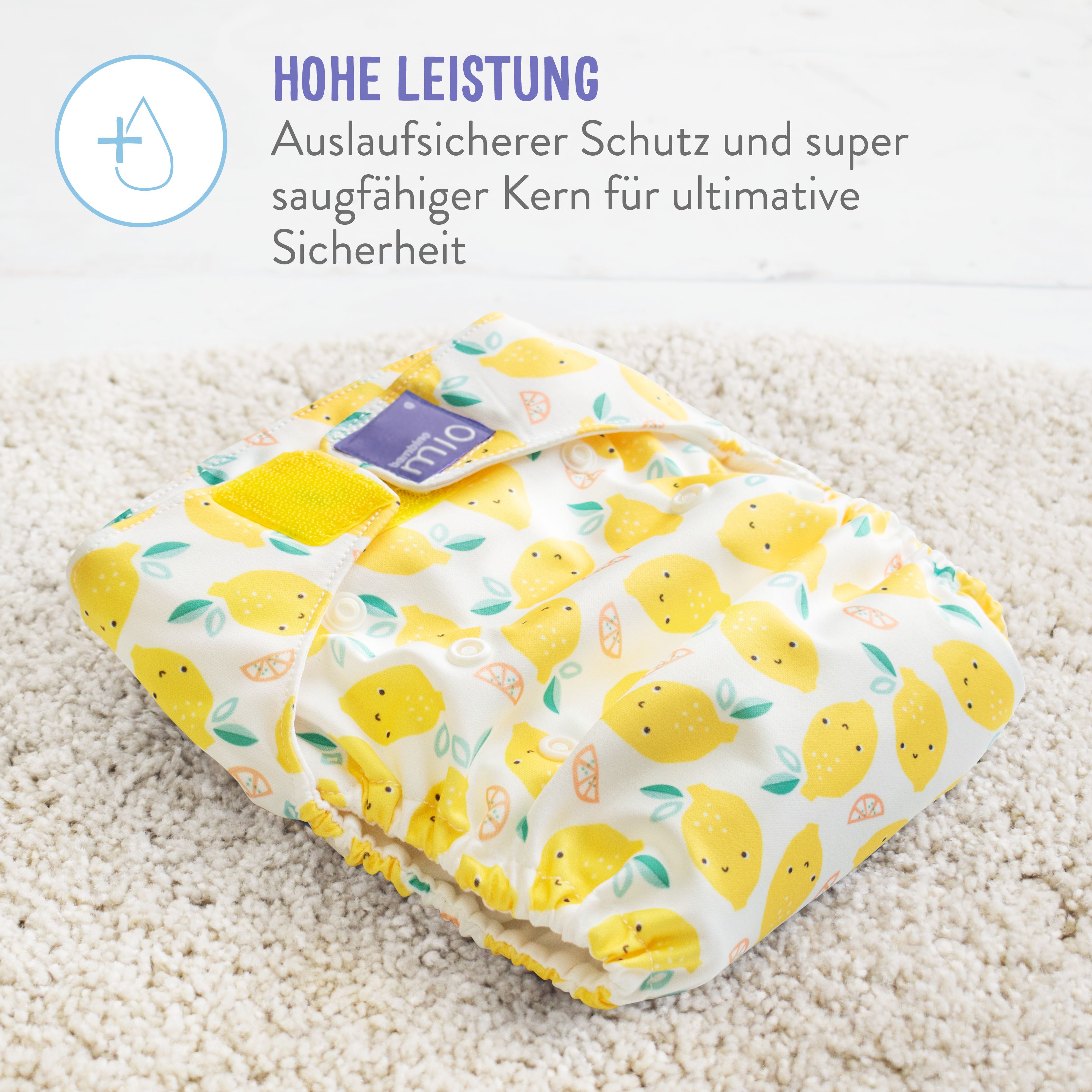 Gelbe Stoffwindel mit Zitronenmuster. Text: Hohe Leistung, auslaufsicherer Schutz und super saugfähiger Kern.