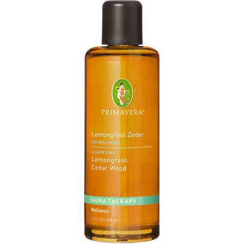 Braune Glasflasche mit schwarzem Deckel. Etikett mit Produktnamen, Logo und Text. Sauna Therapy.