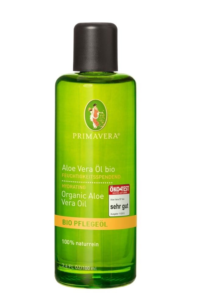 Grüne Flasche mit schwarzem Deckel. Beschriftung: PRIMAVERA, Aloe Vera Öl bio, ÖKO-TEST sehr gut.