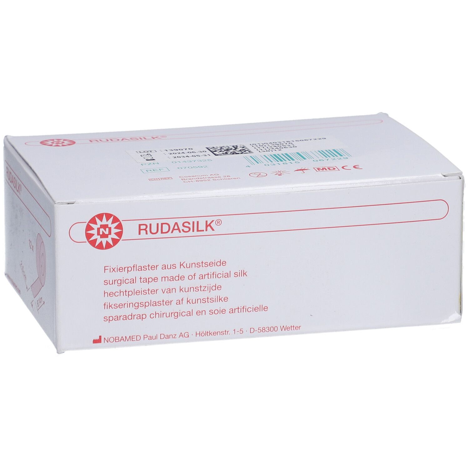 Weiße Verpackung mit rotem RUDASILK Logo. Text: Fixierpflaster aus Kunstseide. Herstelleradresse.