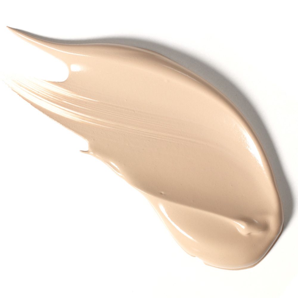 Produktstrich von Make-up. Helle, cremige Textur auf weißem Hintergrund.