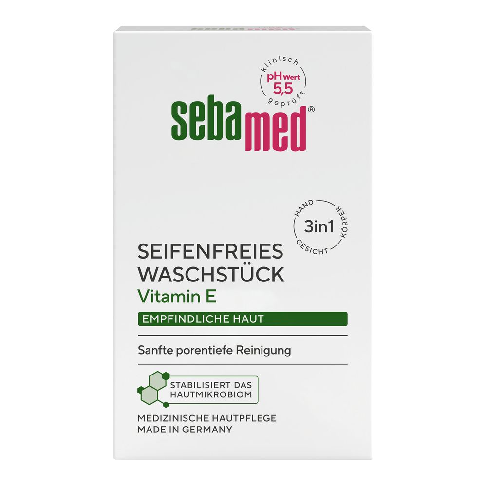 Weißer Karton mit grünem und rotem Logo. Text: seifenfreies Waschstück, Vitamin E, pH 5,5. Medizinische Hautpflege.