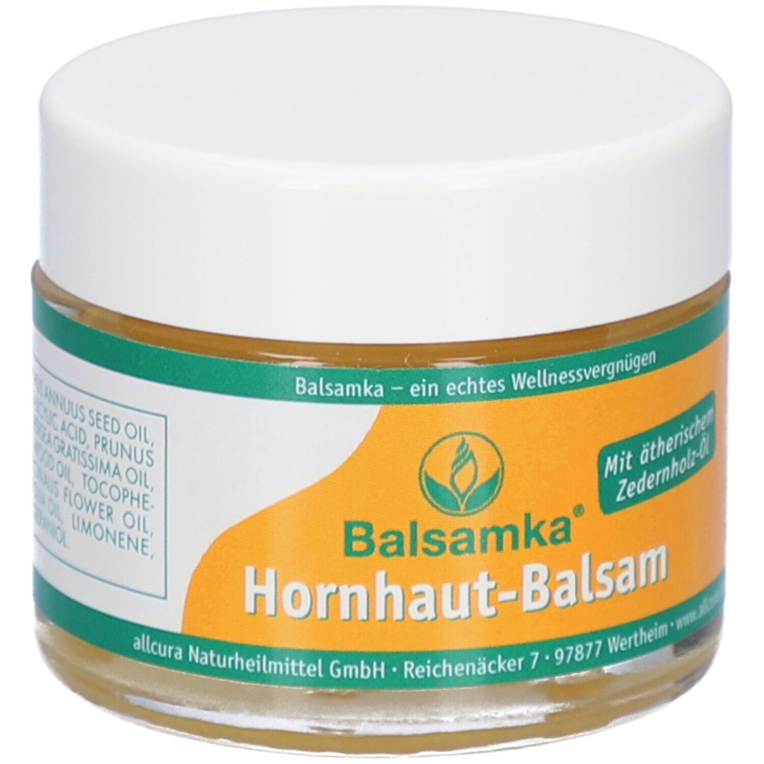 Glas mit Balsamka Hornhaut-Balsam. Weißer Deckel, gelber Aufkleber mit Produktnamen und Logo. Text: Mit ätherischem Zederholz-Öl.