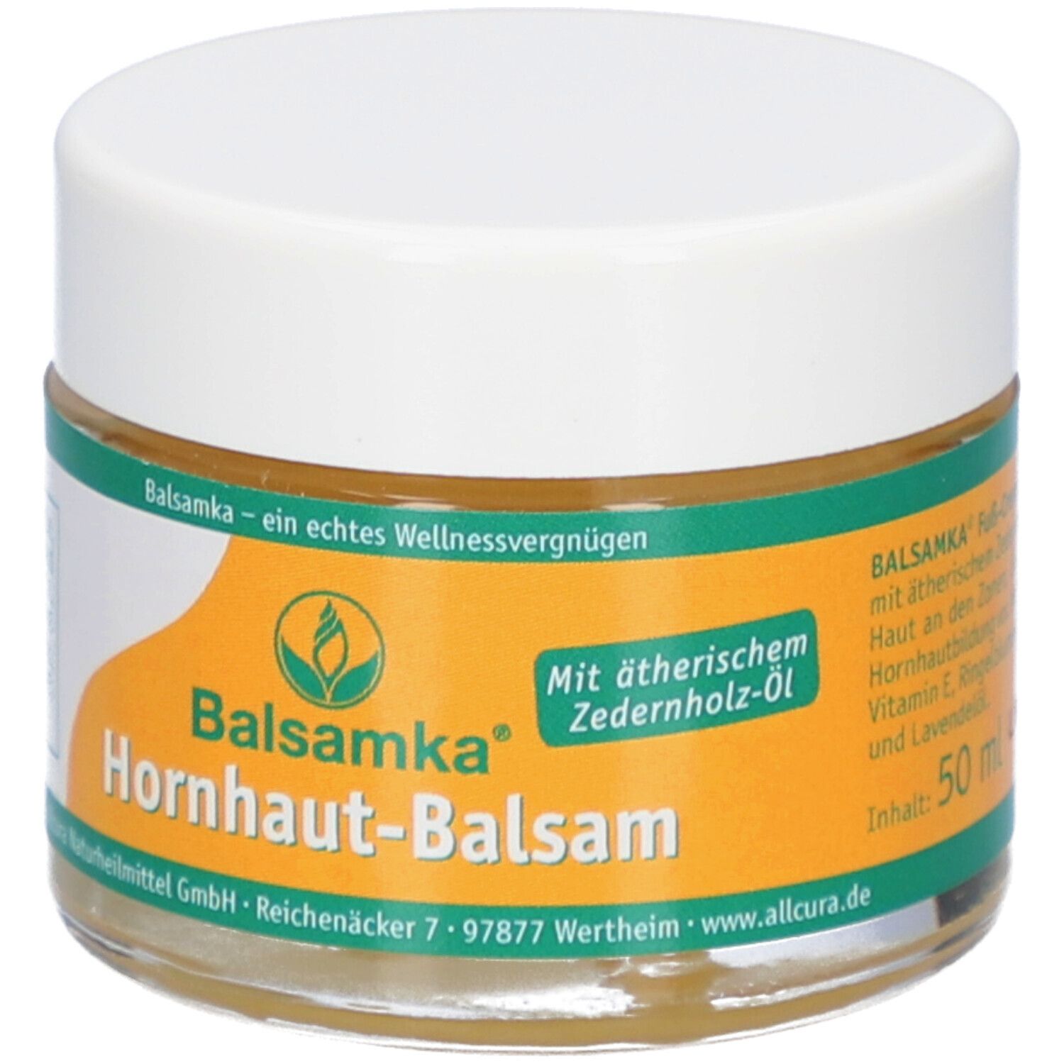 Glas mit Balsamka Hornhaut-Balsam. Weißer Deckel, gelber Aufkleber mit Produktnamen und Logo. Text: Mit ätherischem Zederholz-Öl. Inhalt: 50 ml.