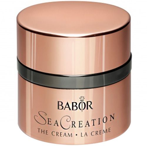 Runder Tiegel mit Deckel. Roségoldfarbenes Gefäß mit schwarzem Ring. Schriftzug BABOR SeaCreation The Cream.