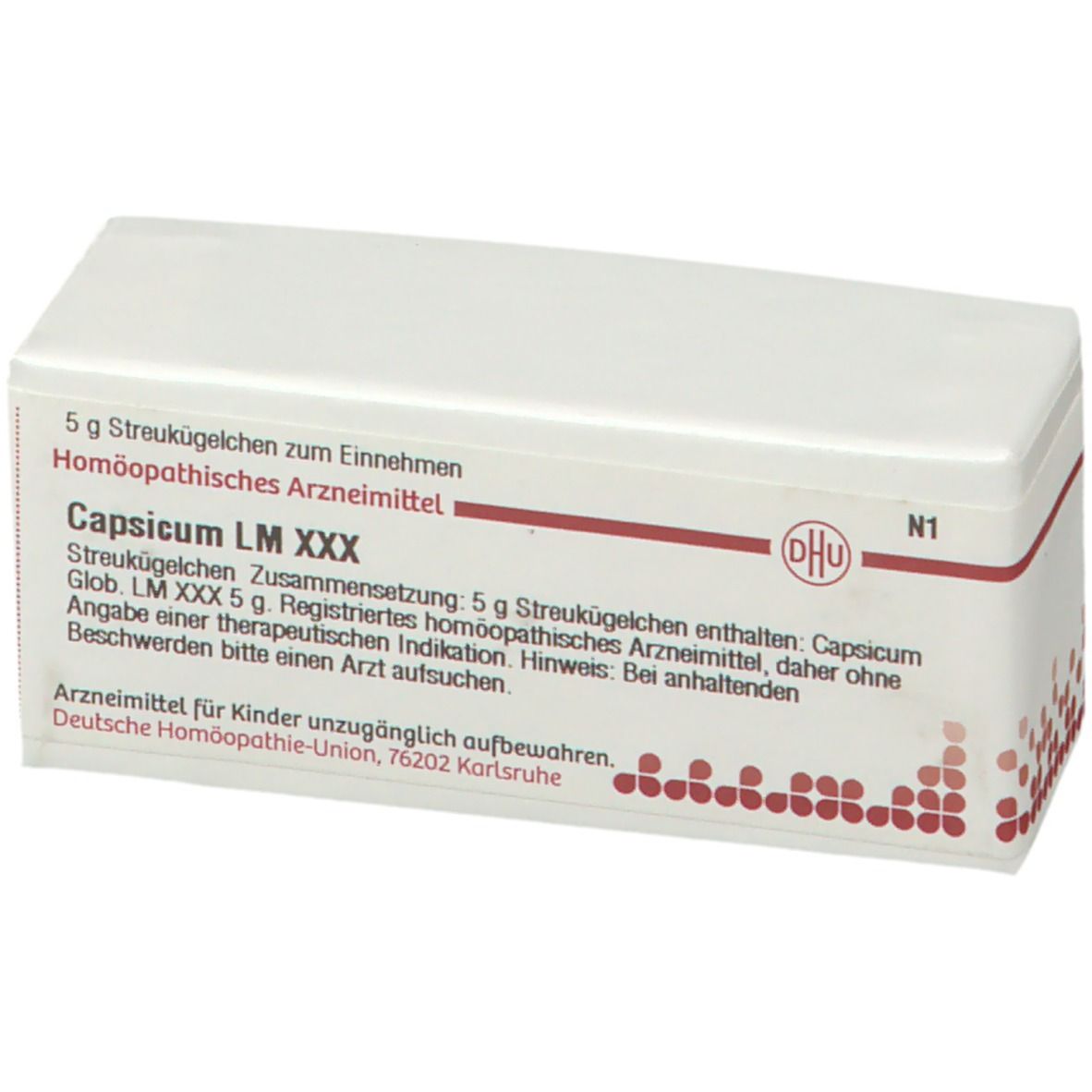 Weiße rechteckige Schachtel mit Produktinformationen. Aufschrift: Capsicum LM XXX, DHU Logo. Enthält Streukügelchen.