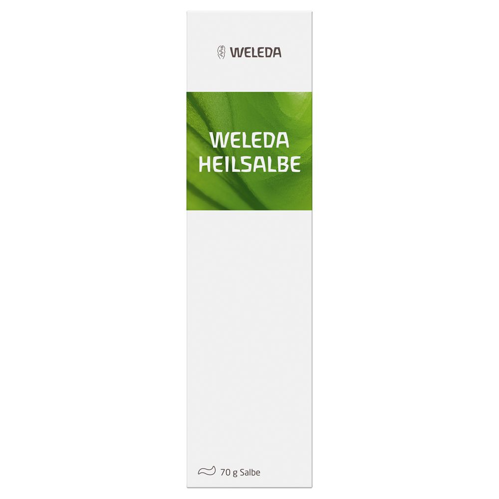 Schachtel mit grüner Aufschrift "Weleda Heilsalbe". Oben steht "Weleda".