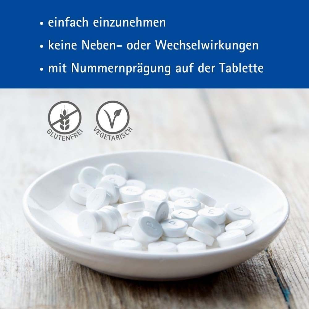Tabletten in einer Schale. Text: glutenfrei, vegetarisch. Mit Nummer auf der Tablette.