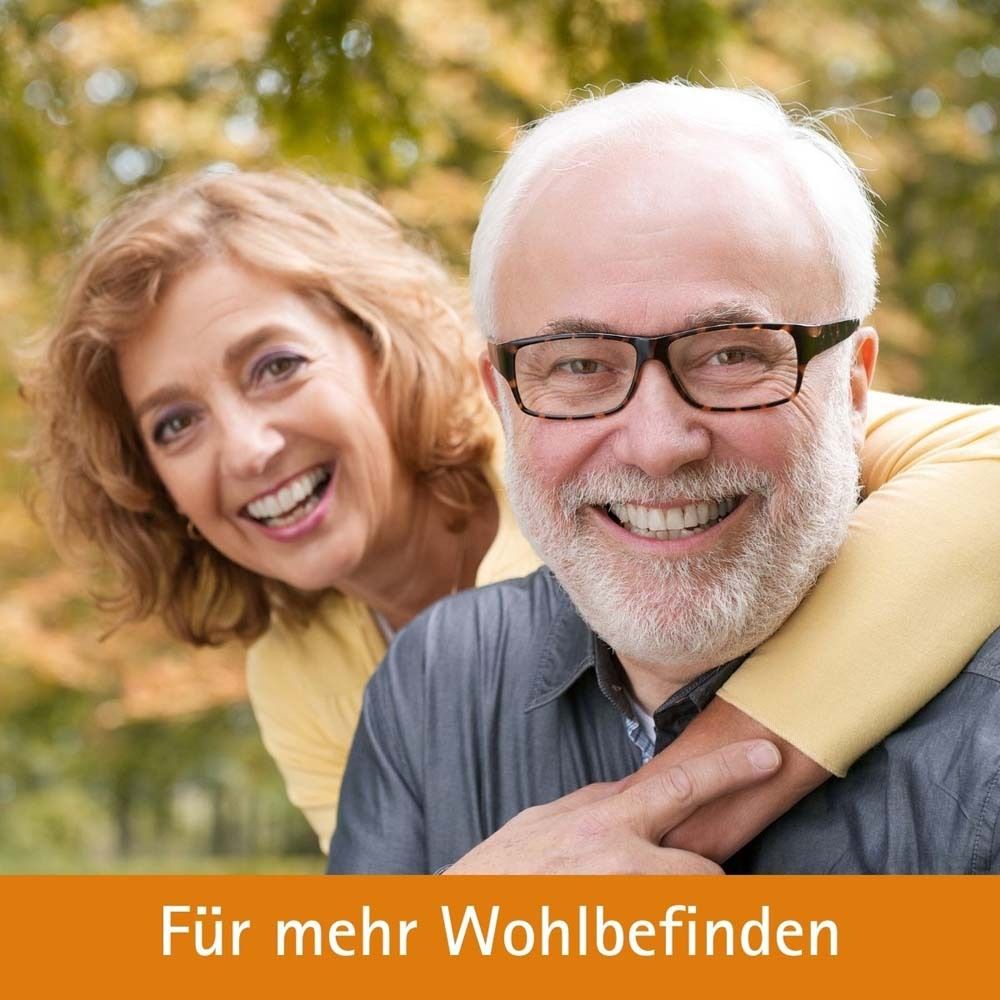 Älteres Ehepaar lächelt. Text: Für mehr Wohlbefinden.