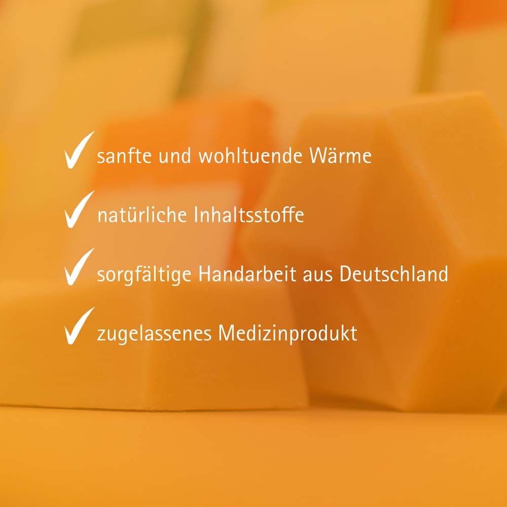 Produktmerkmale: Sanfte Wärme, natürliche Inhaltsstoffe, sorgfältige Handarbeit, Medizinprodukt. Gelbe Blöcke.