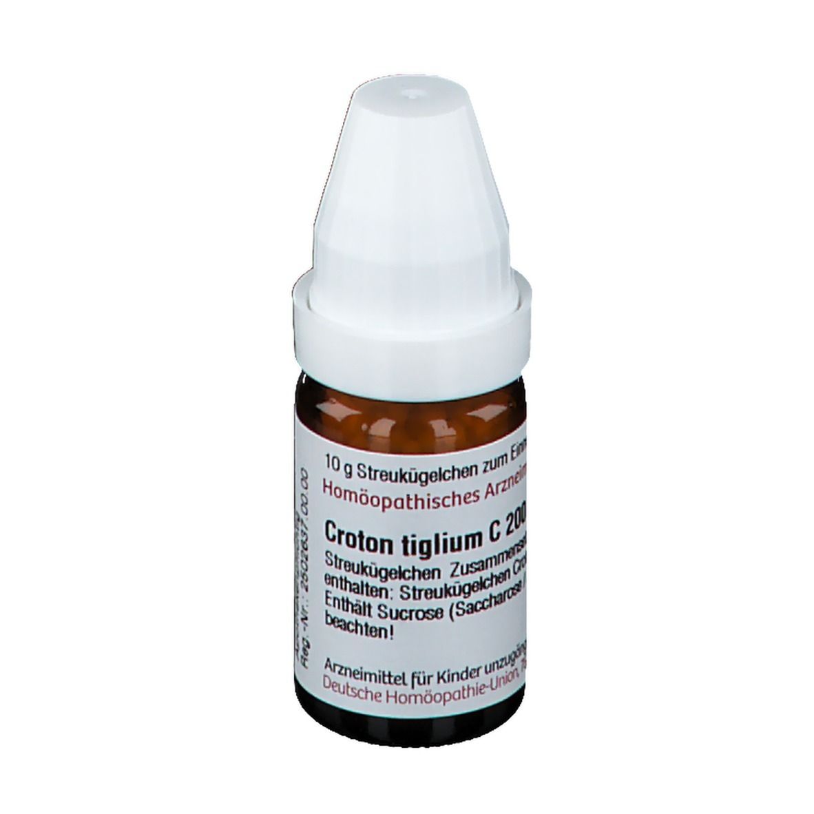 Braune Glasflasche mit weißem Deckel. Beschriftung: Croton tiglium C 200. Enthält Streukügelchen. Deutsche Homöopathie-Union.