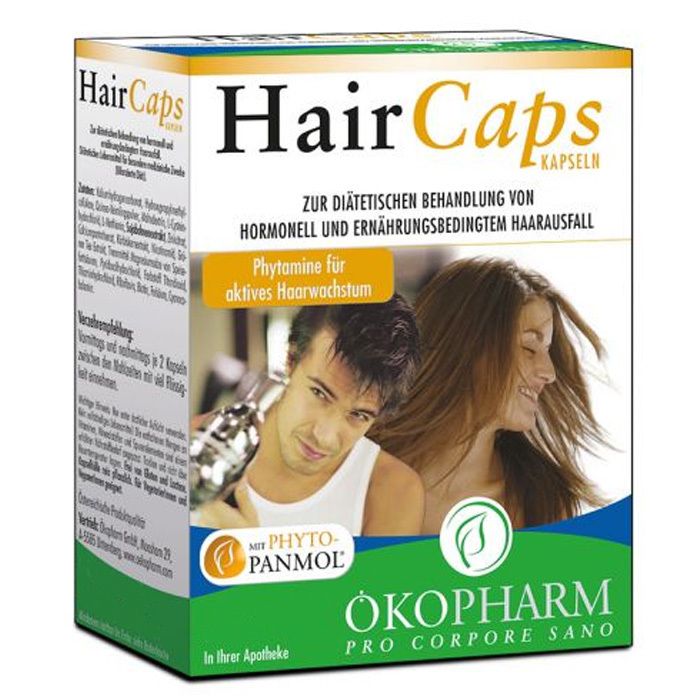 Karton mit Hair Caps Kapseln. Aufschrift: Zur diätetischen Behandlung von hormonell und ernährungsbedingtem Haarausfall. Mit Abbildung von Mann und Frau.