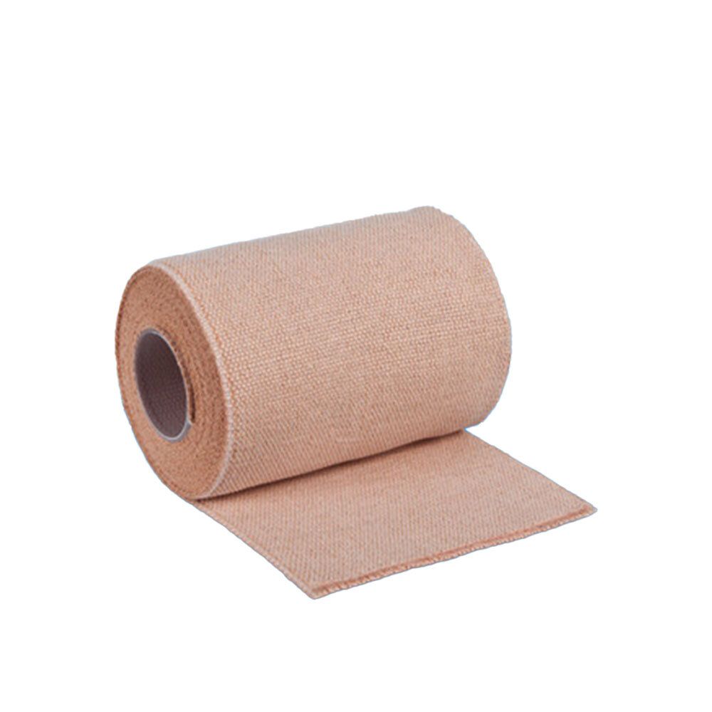 Rolle einer beige farbigen Kurzzugbinde. Material ist gewebt. Die Rolle ist aufgerollt.
