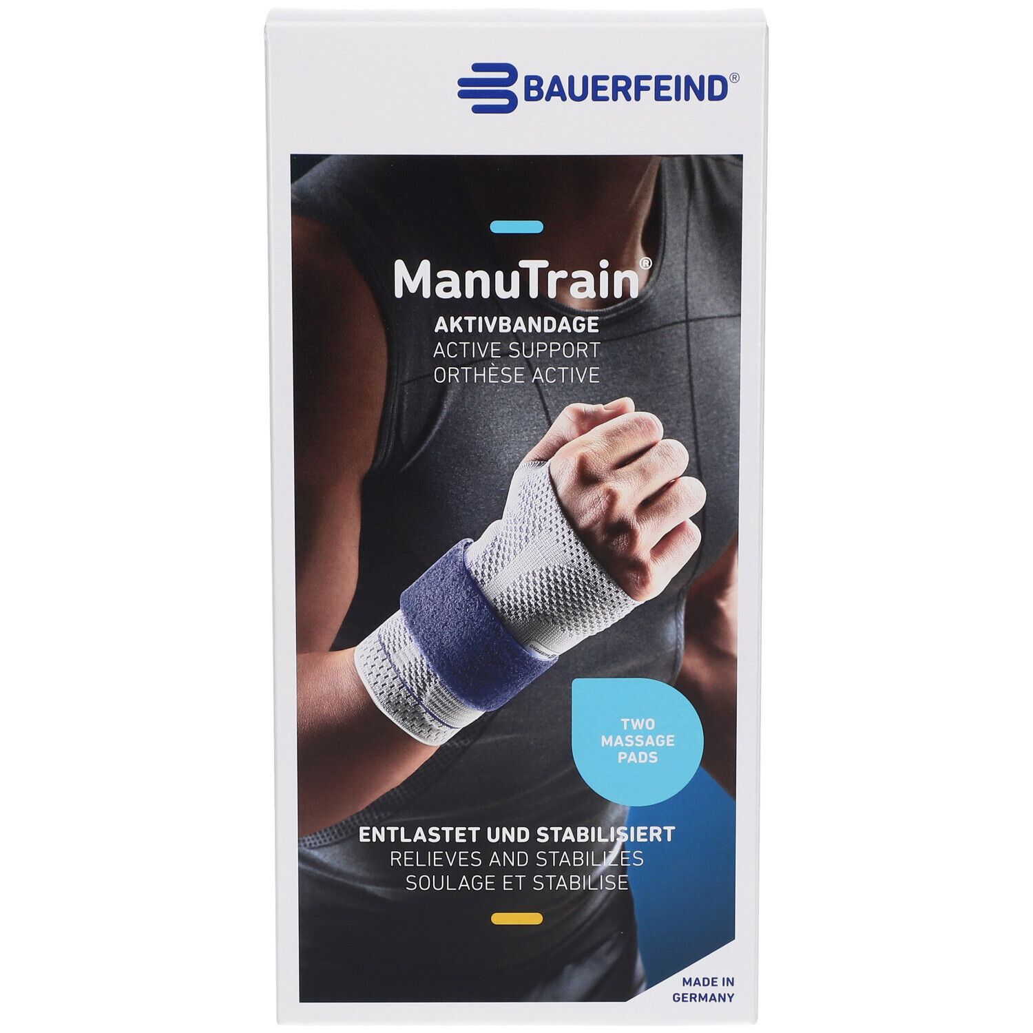 Verpackung mit Handgelenkbandage. Marke Bauerfeind. Aufdruck: ManuTrain, Aktivbandage, zwei Massagepads. Entlastet und stabilisiert. Made in Germany.