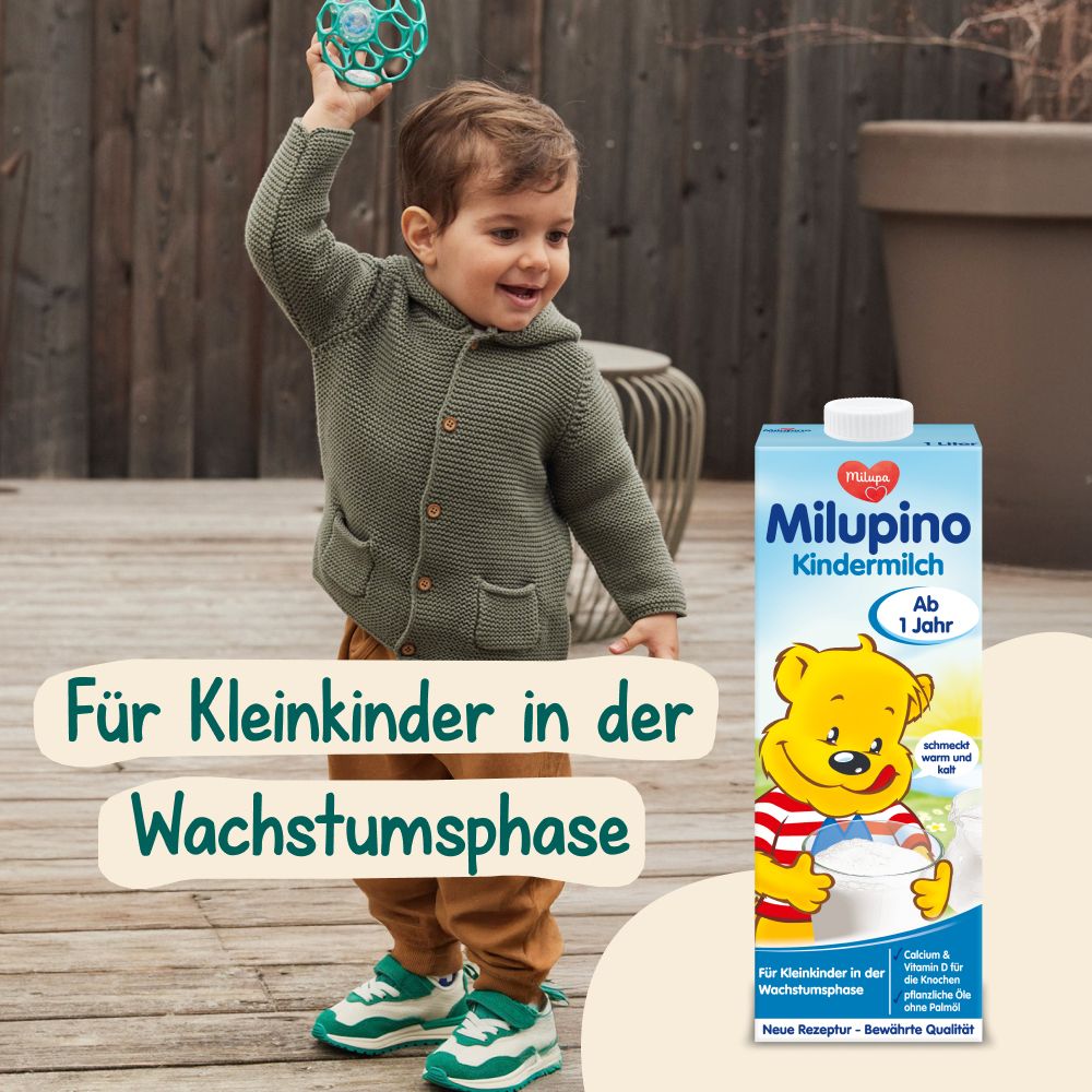Kind mit Milupa Milupino Kindermilch Packung im Freien, für Kleinkinder.