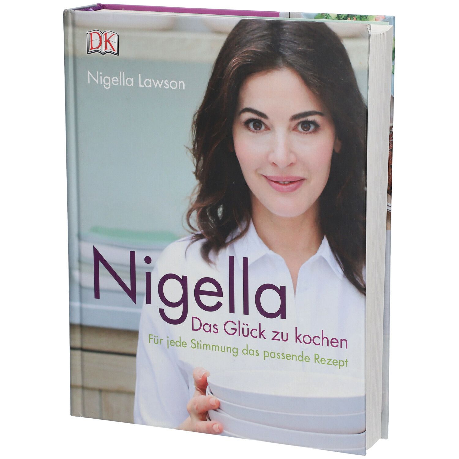 Buch mit dem Titel "Nigella Das Glück zu kochen". Auf dem Cover ist Nigella Lawson abgebildet.
