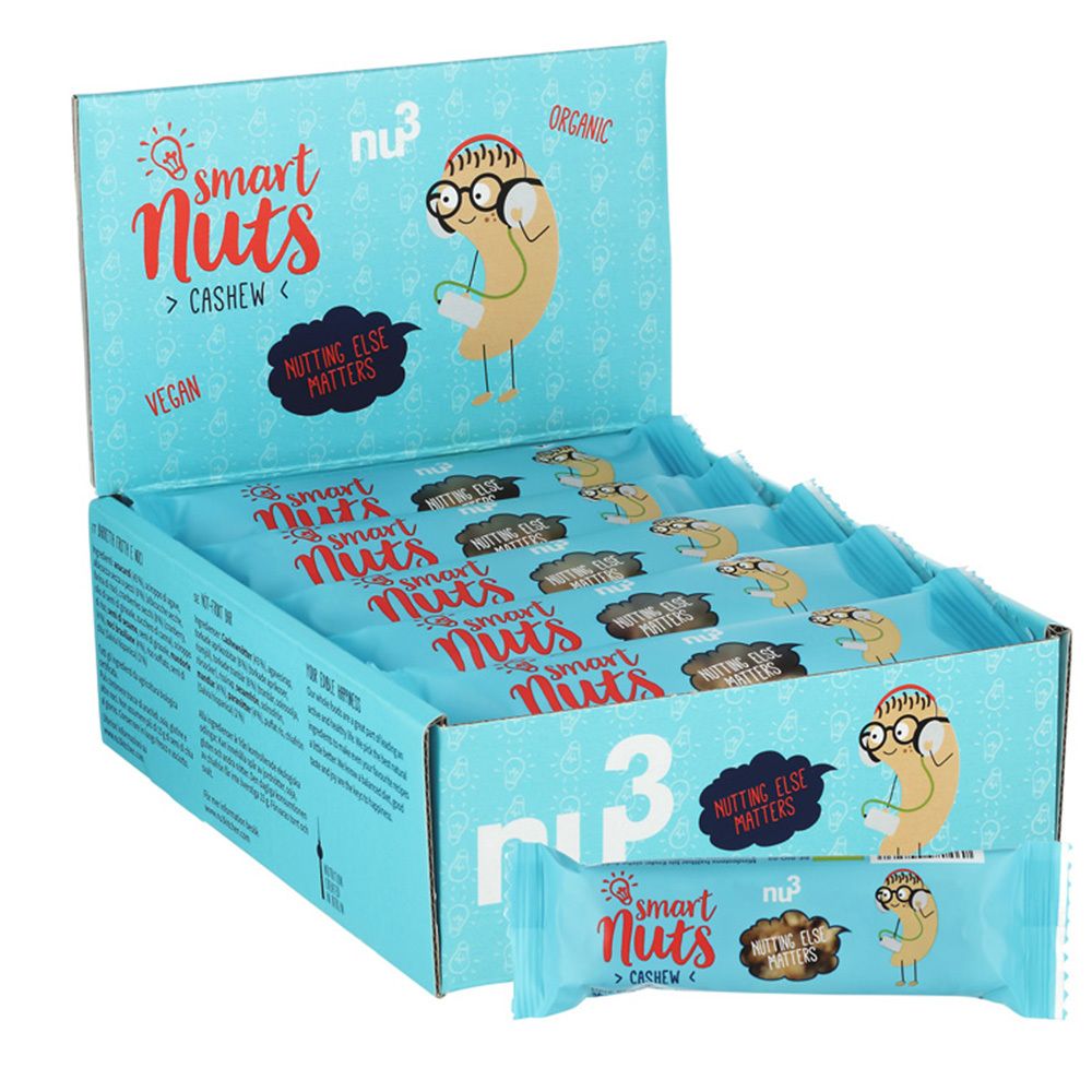 Hellblaue Schachtel mit mehreren Riegeln. Aufschrift: smart Nuts, Cashew, vegan. Ein Riegel liegt vor der Schachtel.
