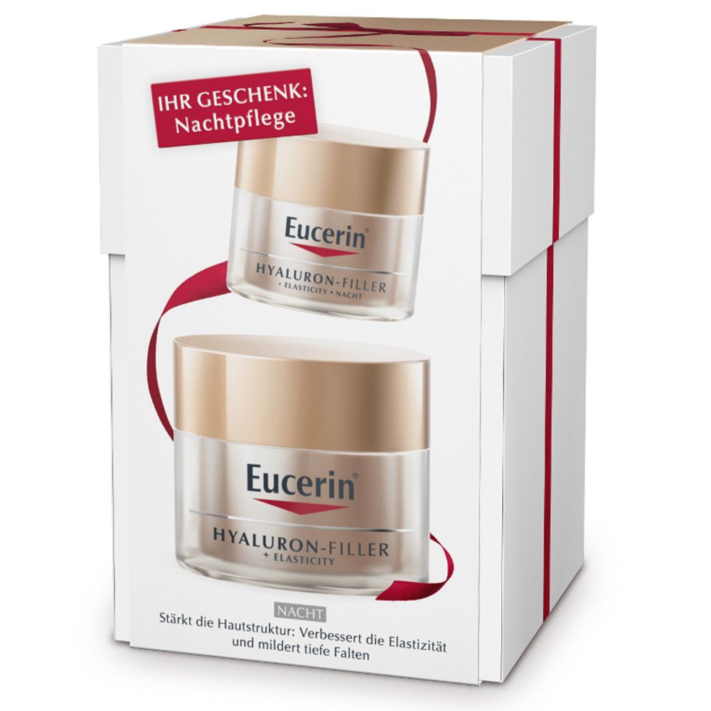 Geschenkset mit zwei Cremes in weißen Schachteln. Aufschrift: Eucerin, Hyaluron-Filler + Elasticity. Rote Schleife und Text.