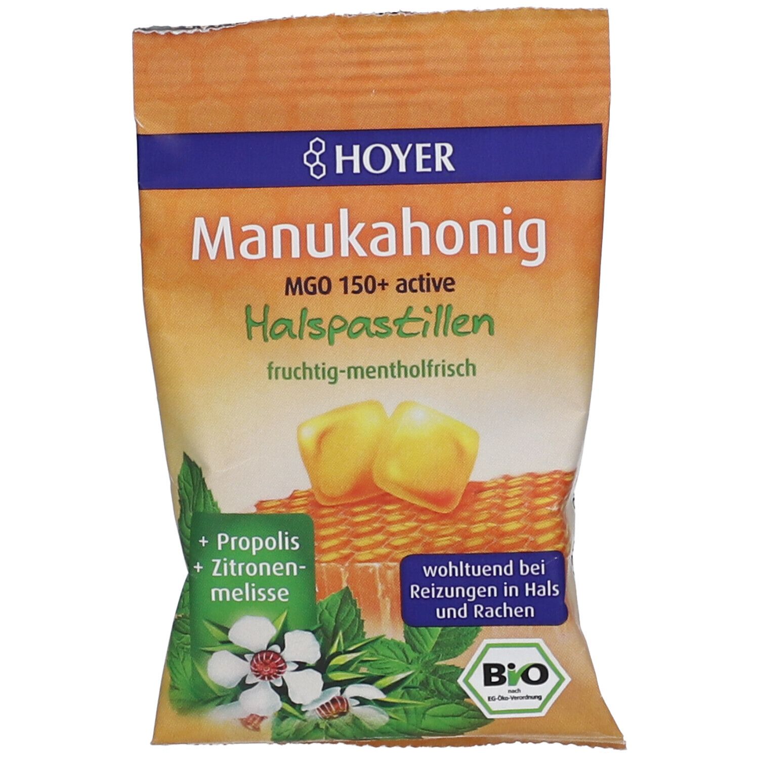 Verpackung mit Pastillen. Aufschrift: Hoyer Manukahonig MGO 150+ active Halspastillen. Illustration von Honigwabe, Kräutern und Pastillen.