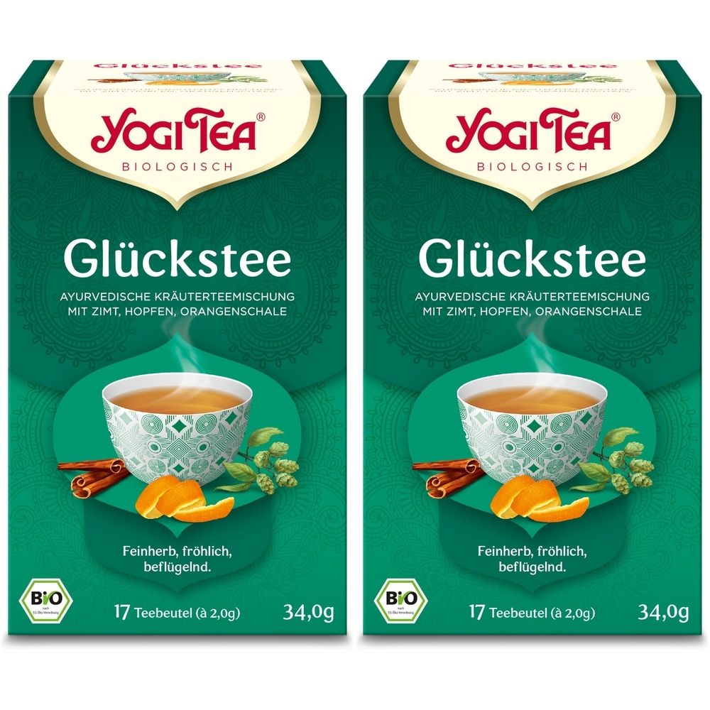 Zwei Packungen Yogi Tea Bio Glückstee. Aufdruck: Glückstee, ayurvedische Kräuterteemischung, 17 Teebeutel, Bio-Siegel.