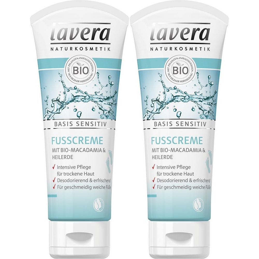 Zwei Tuben Fußcreme. Weiße Tuben mit blauem Design, Aufschrift 'Lavera'. 'Basis Sensitiv' und 'Fußcreme' sind lesbar. Bio-Siegel.