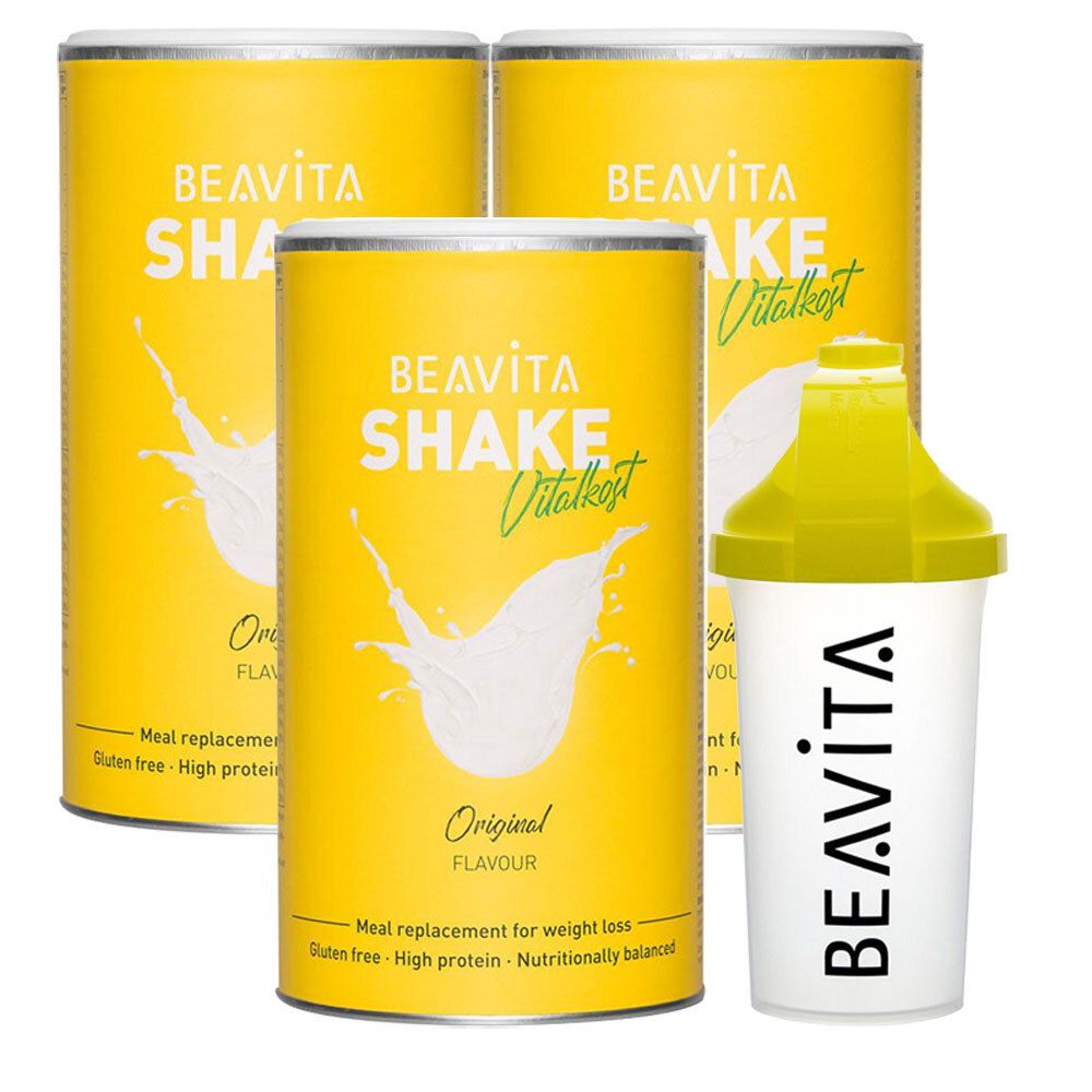 Drei gelbe Dosen und ein Shaker. Auf den Dosen steht "BEAVITA SHAKE Vitalkost Original". Der Shaker ist weiß mit gelbem Deckel.