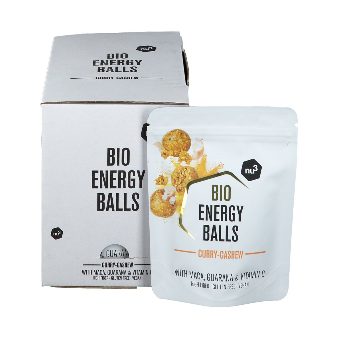 Weiße Kartonverpackung und Beutel mit Aufschrift "BIO ENERGY BALLS Curry-Cashew". Beutel zeigt Produktabbildung und Zutaten.