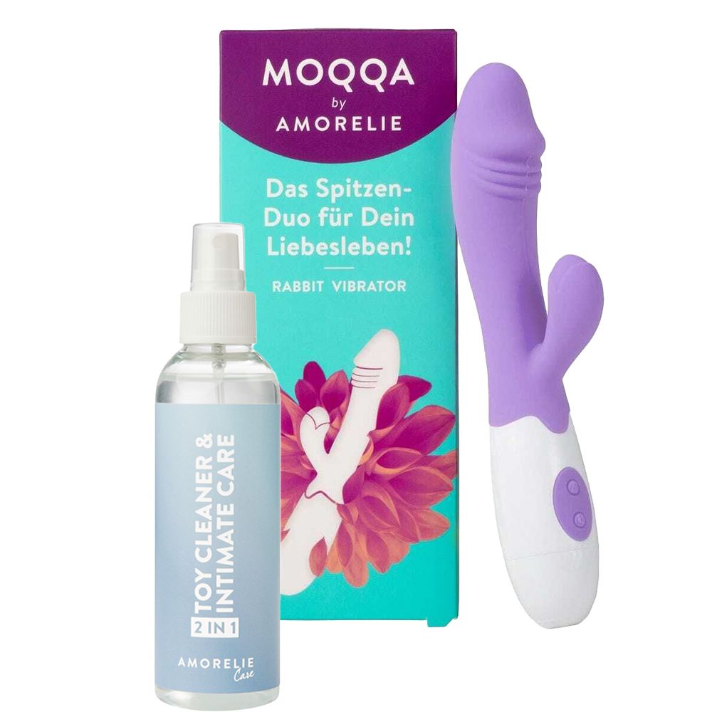Lila und weiße Hasen-Vibrator mit zwei Knöpfen, daneben eine Flasche mit Reiniger und eine Verpackung.