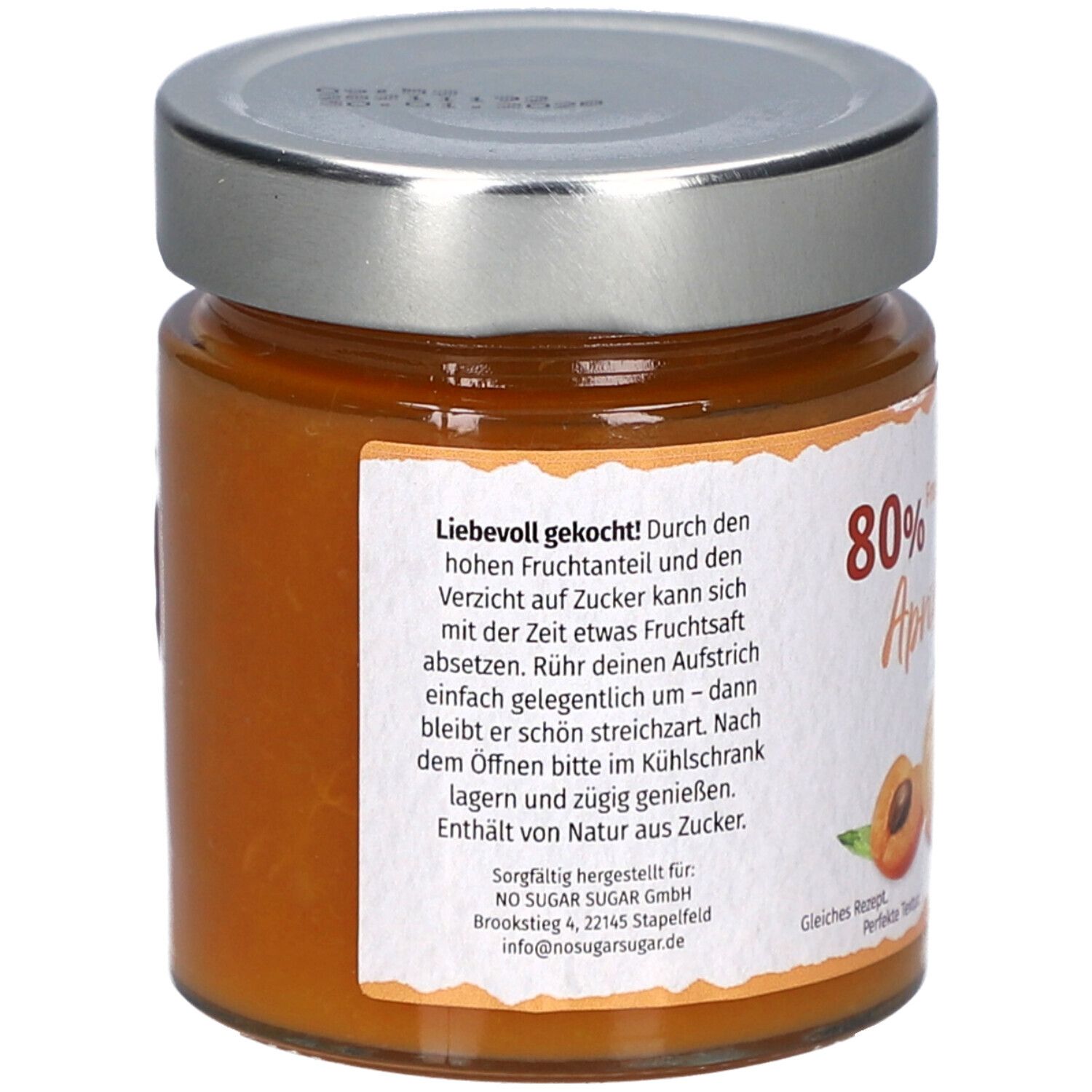 Rückseite eines Glases mit Aprikosen-Fruchtaufstrich. Text: '80% Frucht Marille'. Angaben zu Inhaltsstoffen und Nährwerten.