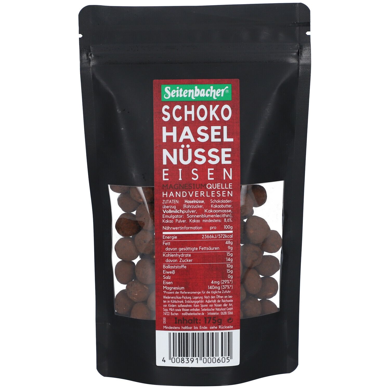Schwarze Tüte mit Sichtfenster. Seitenbacher Schoko Haselnüsse. Rote Schrift. Handverlesen. Nährwertangaben.