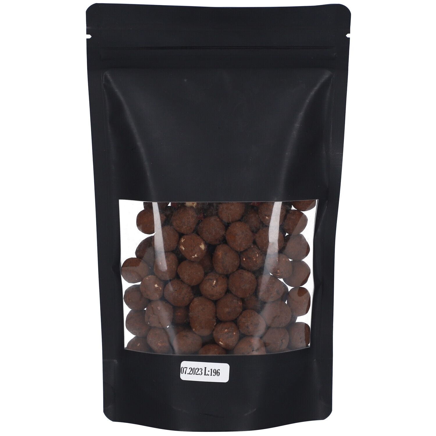 Schwarze Tüte mit Sichtfenster. Schoko Haselnüsse. Kleines Etikett mit Datum und Code.