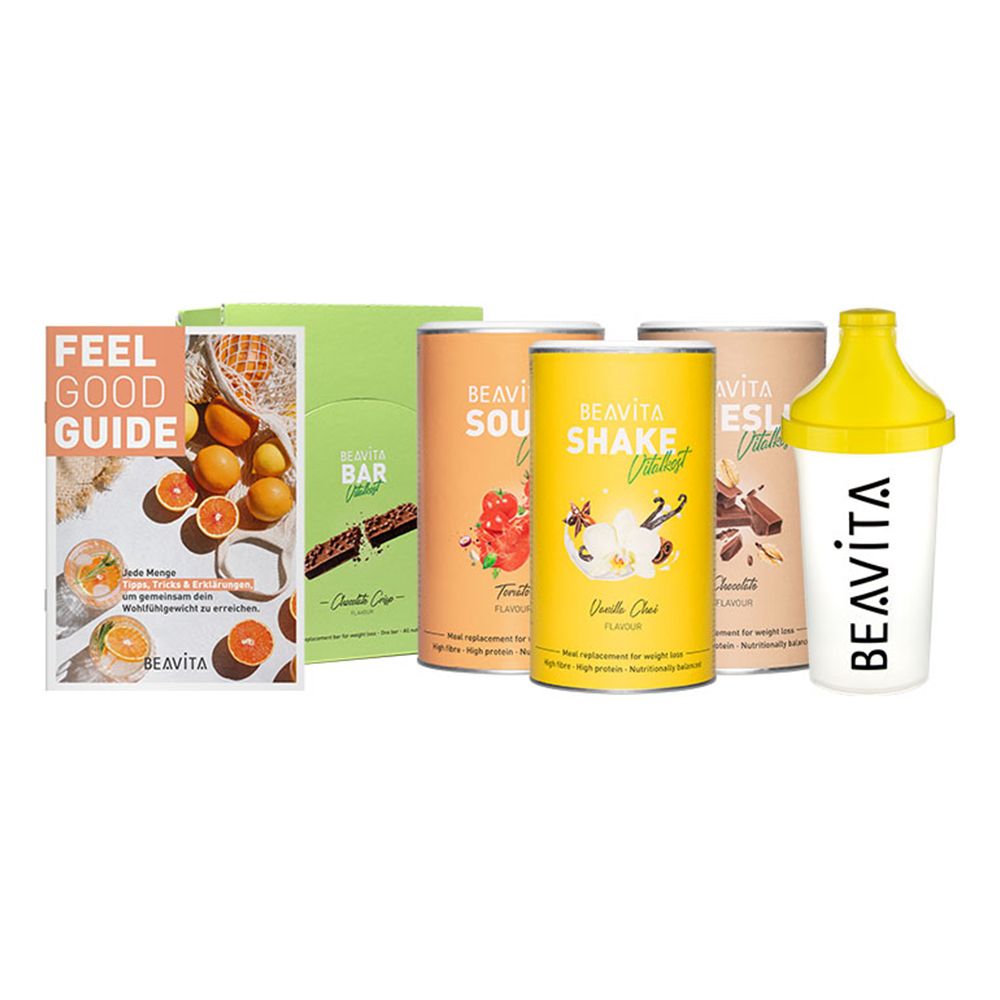 Diät-Set mit Shaker, Büchern, Riegeln und Dosen. Aufschrift: BEAVITA, Shake, Bar, Feel Good Guide.