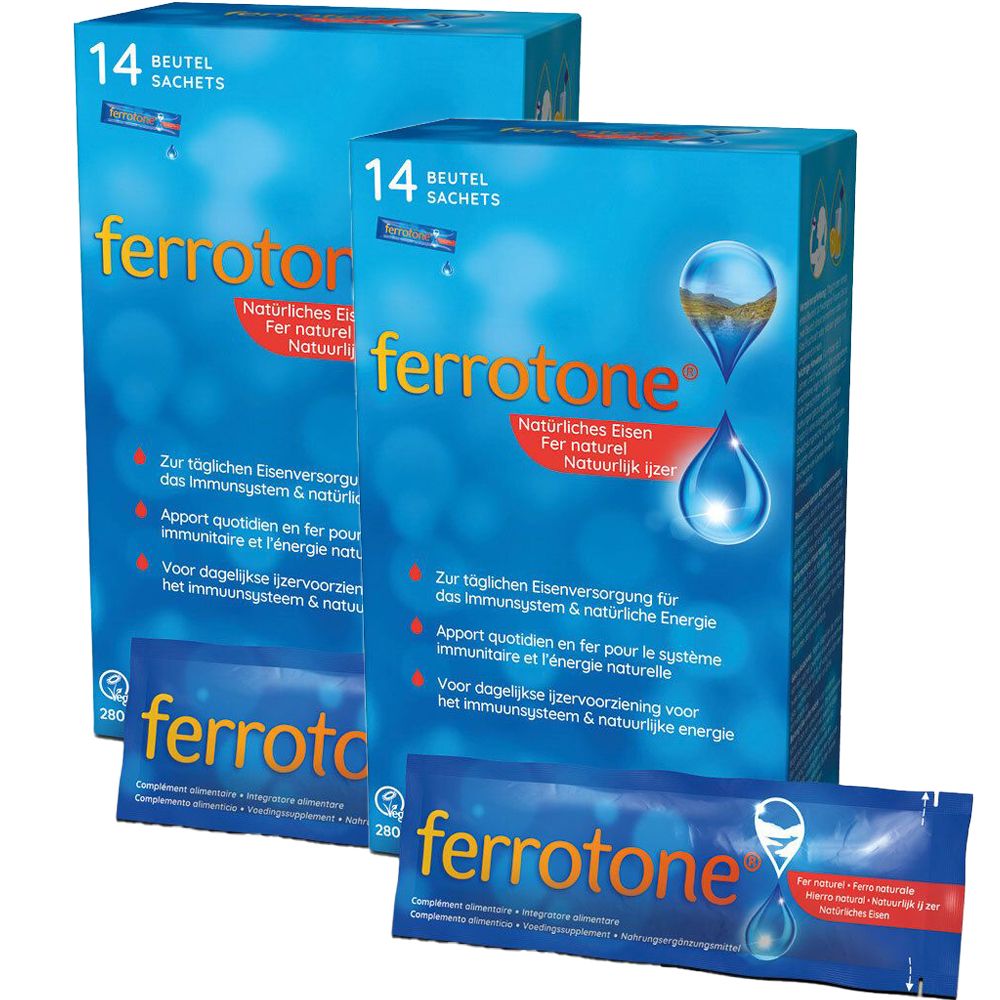 Zwei blaue Schachteln mit "ferrotone"-Packungen. Aufschrift: "Natürliches Eisen". Eine einzelne Packung liegt davor.