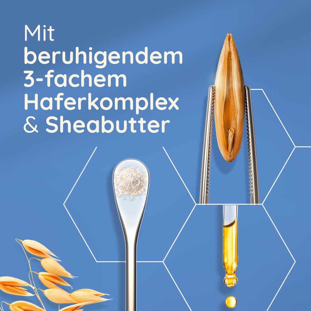 Nahaufnahme von Haferkomplex und Sheabutter. Text: Mit beruhigendem 3-fachem Haferkomplex & Sheabutter.