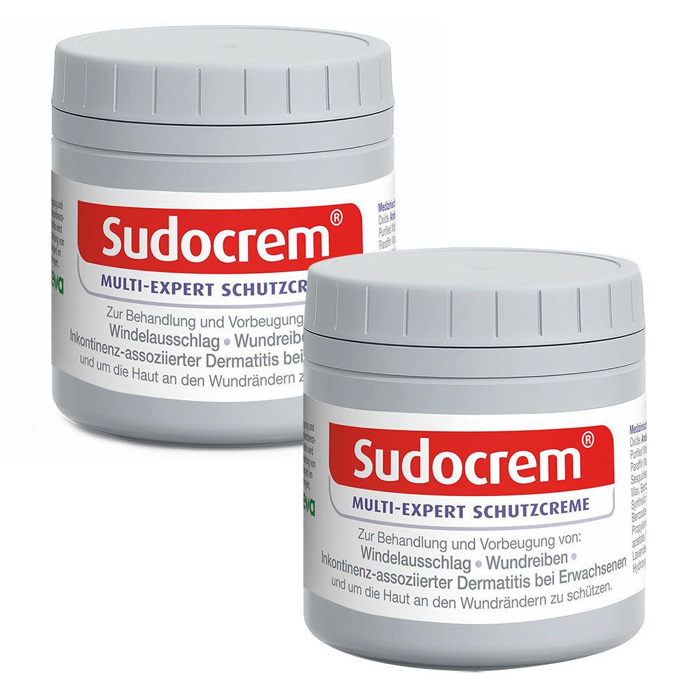 Zwei graue Tiegel Sudocrem® MULTI-EXPERT SCHUTZCREME. Roter Deckel mit weißer Schrift. Aufschrift: Sudocrem®.