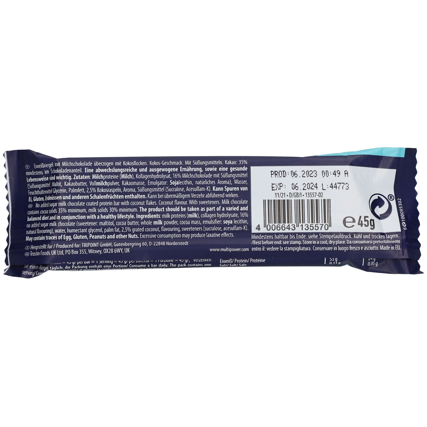 Rückseite des Proteinriegels. Blaue Verpackung mit Text und Nährwertangaben. Enthält Informationen zu Inhaltsstoffen und Haltbarkeit.