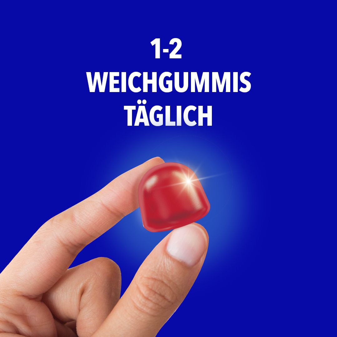 Hand hält eine rote Weichgummi. Text: 1-2 WEICHGUMMIS TÄGLICH.