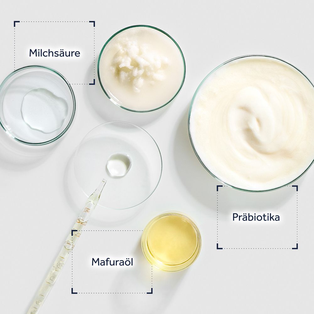 Zutaten für Hautpflege: Milchäure, Mafuraöl, Präbiotika in Laborbehältern.